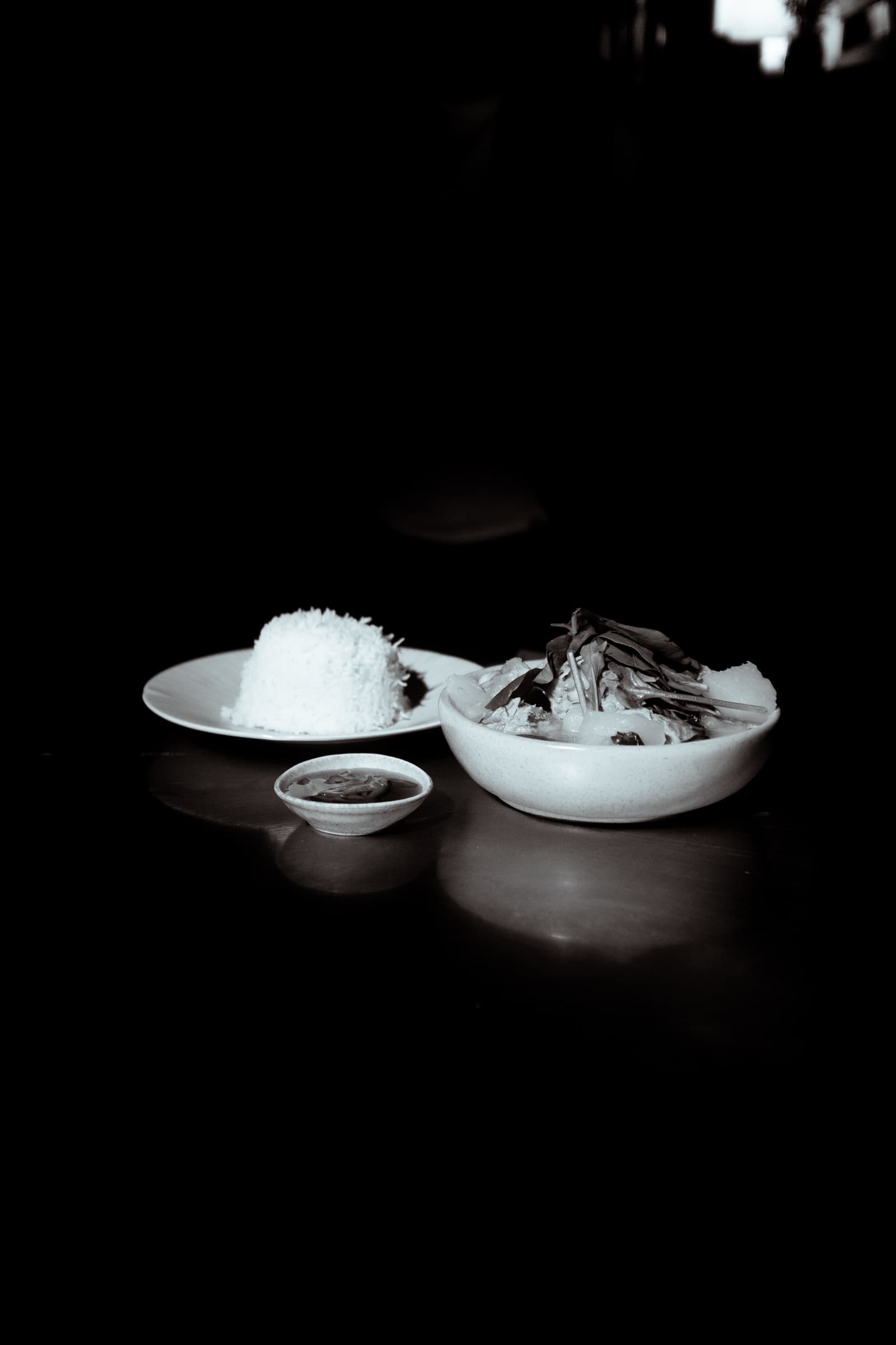 A finished plate alone in a pool of light